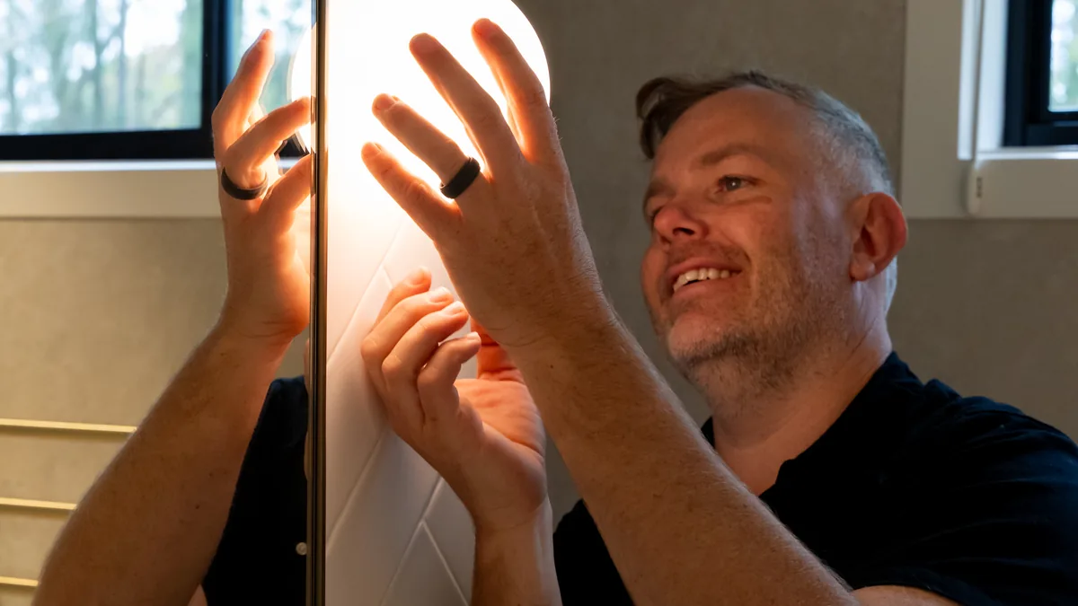 Fix Electrical electrician fitting a bathroom mirror